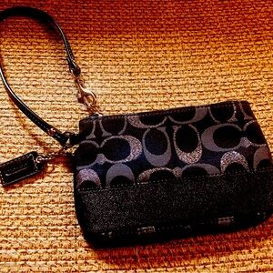 A small coach wristlet purse. Excellent condition.￼ coach